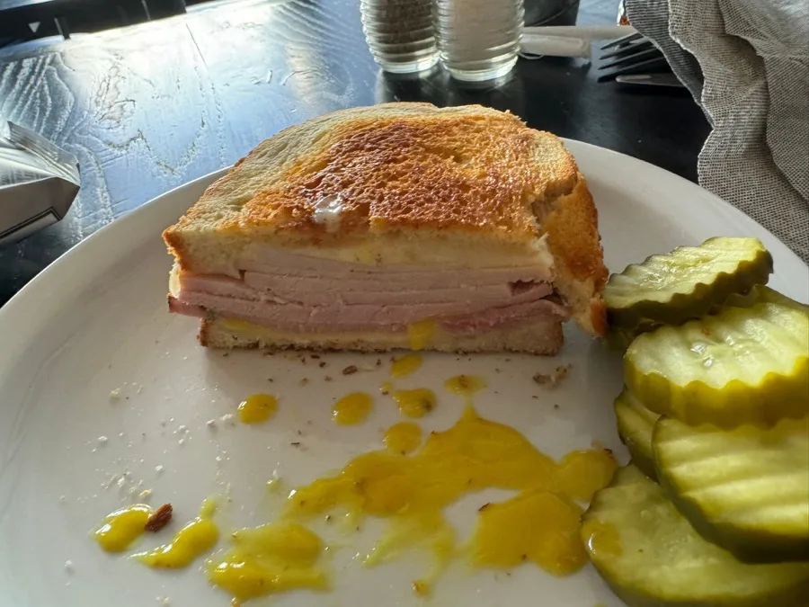 Grilled sandwich with pickles served at 5 South Main